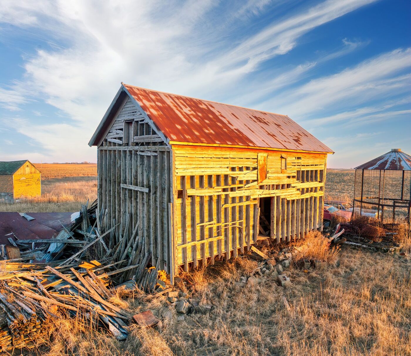 The Faded Cardinal, a heritage structure in managed decline, in open River Valley farmland.